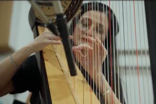 A still from the official 'Tell Me It's Not True' video featuring Coleraine harpist Lesley Magee. The single was recorded by Natalie Rushdie as a tribute to the late Dame Deborah James to raise money for the Bowel Babe Fund Credit Sarah Hardy