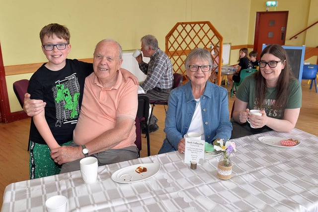 Enjoying a cuppa at the Thomas Street Methodist Youth Fellowship coffee morning are members of the Cranston family from left, Luke (10), Ian, Elizabeth and Valerie. PT26-208.