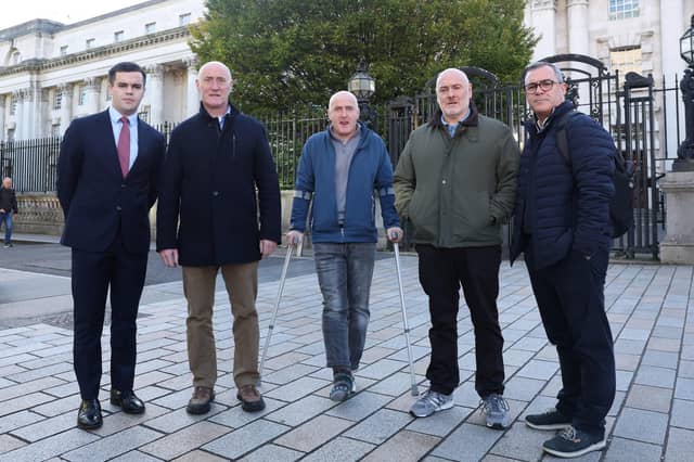 The family of Sean Farmer pictured outside the High Court in Belfast with Diarmuid Brecknell from Phoniex Law and Alan Brecknell from the Pat Finucane Centre. Picture: Jonathan Porter/PressEye