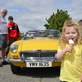 Olivia Brown keeps cool during the car show at Ballyclare May Fair.