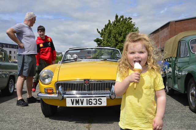 Olivia Brown keeps cool during the car show at Ballyclare May Fair.
