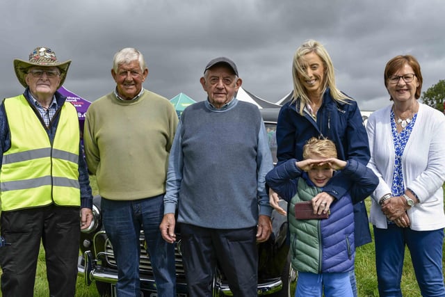 Enjoying the Birches Vintage Rally on Saturday are, from left: Holt McKeown, Jim Hill, John Wilson, Upper Bann MP Carla Lockhart with her son, and Marlene McKeown.