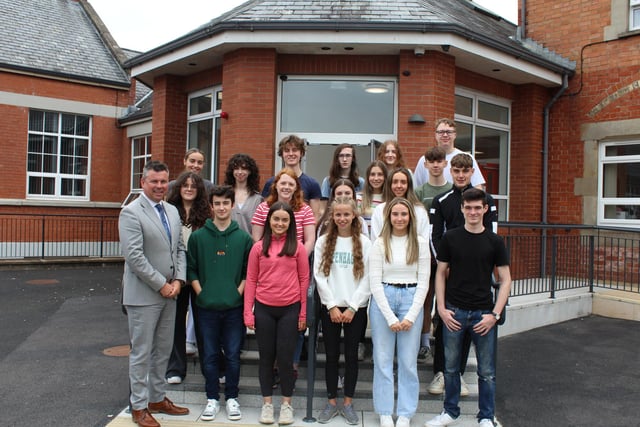 Rainey Endowed School principal Mark McCullough pictured with pupils who obtained 3 A Grades-AS.
