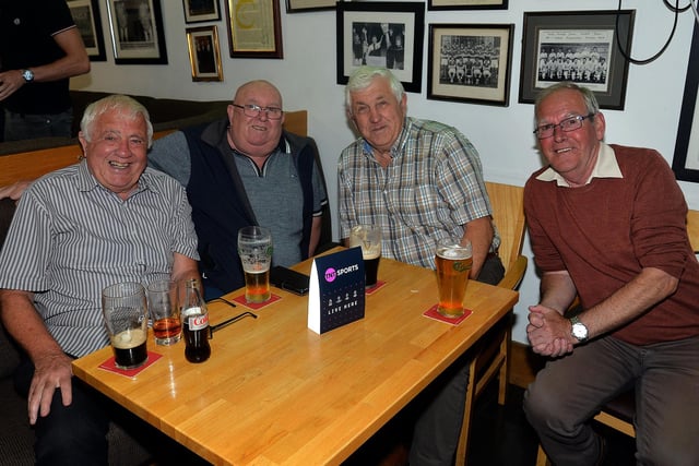 Enjoying a quiet pint at the Derrymacash charity weekend are the Breen brothers, Joe, John and Seamus and John McCavigan. LM35-256.