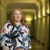 Prisons minister Naomi Long has been challenged by the UUP's Doug Beattie to provide clarity on policy for housing transgender inmates.
