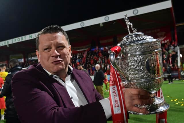 Kenny Bruce celebrates with the Gibson Cup in 2023. (Photo by Colm Lenaghan/Pacemaker Press)