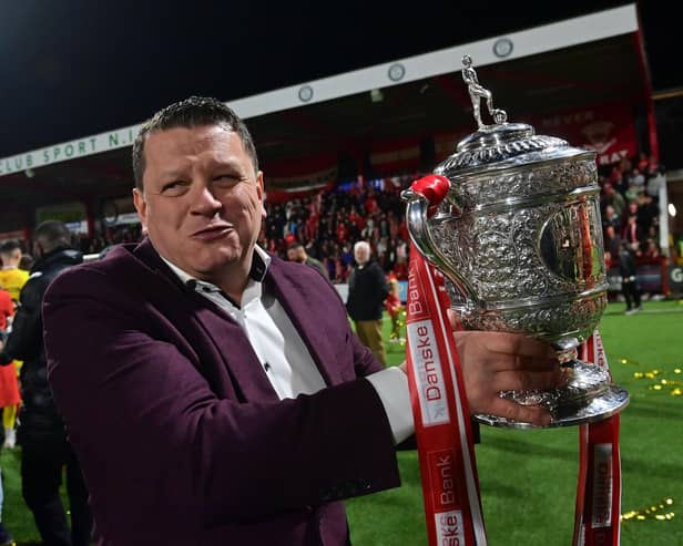Kenny Bruce celebrates with the Gibson Cup in 2023. (Photo by Colm Lenaghan/Pacemaker Press)