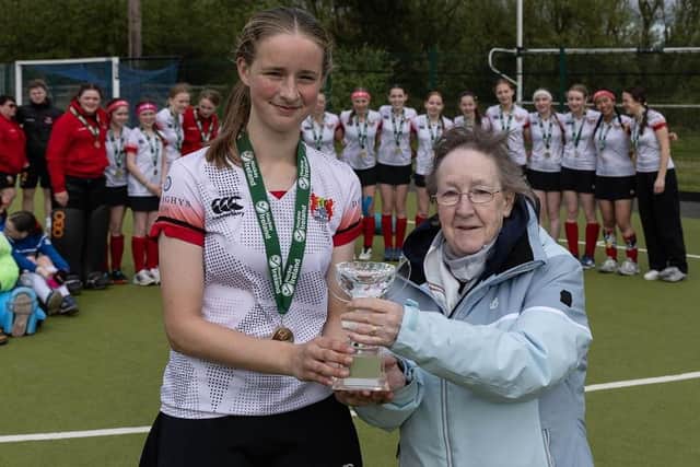 ​June Smith presents Hannah Carswell with the trophy.