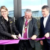 Dehenna Davison, Parliamentary Under-Secretary of State for the Department for Levelling Up, Housing and Communities cuts the ribbon on the new pavilion building at Portrush Recreation Grounds along with the Mayor of Causeway Coast and Glens Borough Council, Councillor Ivor Wallace and Mark O’Donnell, Deputy Secretary for Department for Communities (DfC).