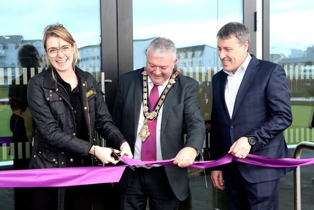 Dehenna Davison, Parliamentary Under-Secretary of State for the Department for Levelling Up, Housing and Communities cuts the ribbon on the new pavilion building at Portrush Recreation Grounds along with the Mayor of Causeway Coast and Glens Borough Council, Councillor Ivor Wallace and Mark O’Donnell, Deputy Secretary for Department for Communities (DfC).