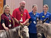 Staff from Ward 11 with the donkeys. Pic credit: SEHSCT