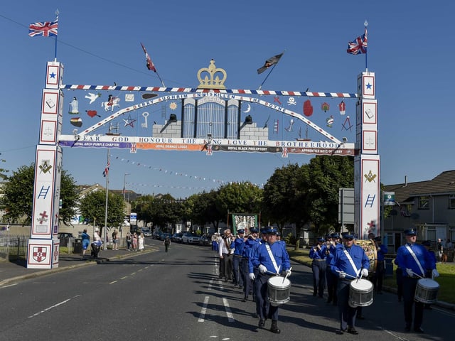 Under the arch during the Royal Black Institution parade in Lurgan on Tuesday morning.