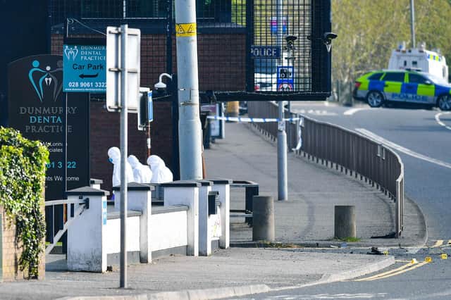 Forensic teams at the scene of the security alert outside Dunmurry police station. Picture: Andrew McCarroll / Pacemaker