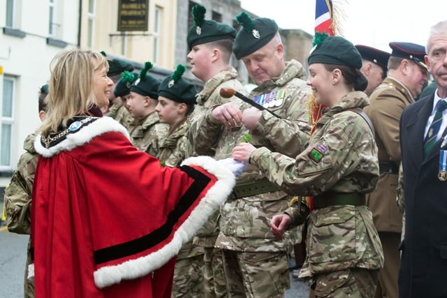 Lord Mayor of ABC Council, Alderman Margaret Tinsley presents a sprig of shamrock to her daughter, Anna, who is a member of the Army Cadets. PT12-205.