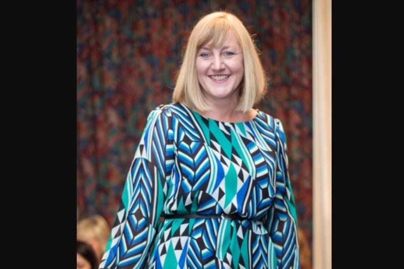 Elaine models a patterned print at the 2012 fashion show.