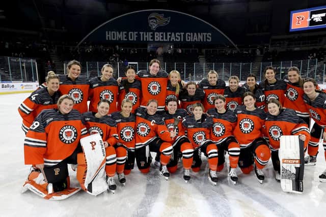 The Princeton Tigers' team celebrates with The Belpot Trophy after Saturday afternoon's Friendship series win against the Providence Friars.    The Friendship Series is the first and only NCAA Division 1 women’s hockey tournament to be held outside of the United States. Photo by William Cherry/Presseye