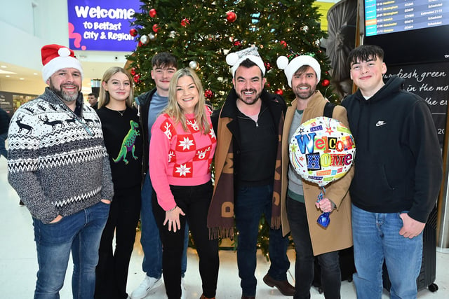 Amanda Morrow meeting her brother Ben and his husband Hugh who have flown home from Australia, her fiancé Phil and her children Matthew and Nathan reunited for Christmas at George Best Belfast City Airport on Saturday.