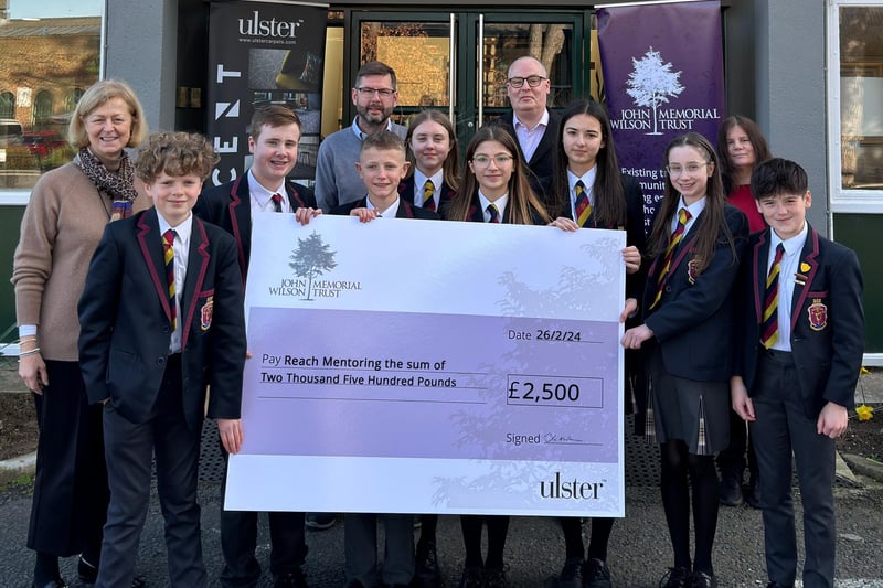 Students from Lurgan Junior High School who secured £2,500 for Reach Mentoring by taking part in The John Wilson Memorial Trust School Charity Challenge. Also included are Trustees Caroline Whiteside, Jeremy Wilson, Simon Wilson and Caroline Somerville.