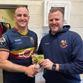 ​Alex Thompson receives the Karri Kitchen man-of-the-match award from Bann's Director of Rugby Marc Eadie after the side's game at Cashel.