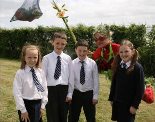 St Nicholas' Primary School pupils Amy Drury, Peter Dillon, Conor Taggart and Alice McQuillan attended the 2007 launch of Carrick in Bloom at the Andrew Jackson Centre. Ct21-066tc