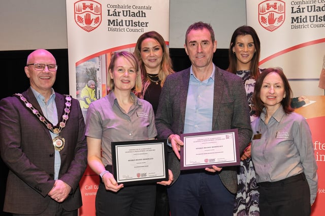Pictured with the Chair of the Council, Councillor Dominic Molloy, Councillor Nuala McLernon and Councillor Eimear Carney are members of staff from Seamus Heaney HomePlace, including centre manager, Brian McCormick, who completed Autism Impact awards and who helped achieve the Sandford Award for Heritage Education 2023.