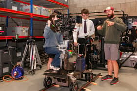 Northern Ireland film grip Donavan Gallagher pictured at Panavision Belfast with Cara from Friends School Lisburn and Aaron from Belfast Royal Academy learning how to work the equipment on a film set. Credit: Submitted