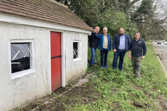 Kenny Lynass, Bobby Boyd , Mark Baxter and Rodney Adamson at the model cottage in Waringstown, Co Down which was wrecked by vandals last weekend.