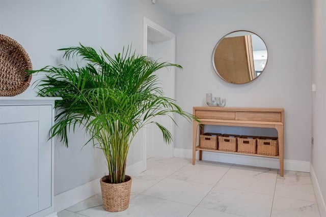 Spacious reception hall with porcelain tiled flooring.