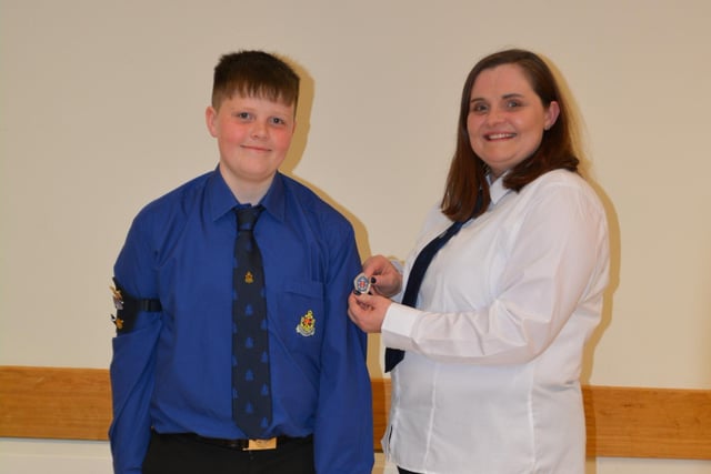 Jamie Shaw with his mother Karina presenting him with his President's badge.