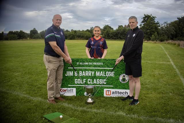 Kieran Shields, Chairman and Brian McKeown with Ruby Murphy.