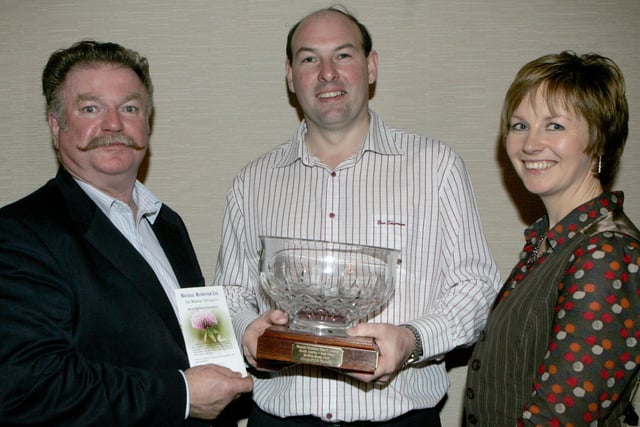 John McKay, champion flock winner, with Peter Mackle from Natural Nutrition and Elizabeth Gould Judge at the North Antrim East Londonderry Suffolk sheep dinner held at McLaughlin's Corner in 2009