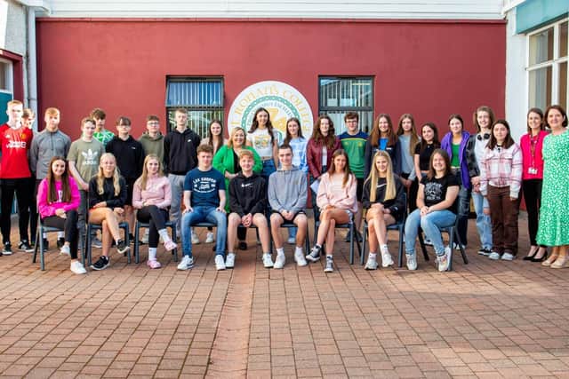 Pupils of St Ronan's College, Lurgan who achieved 9x A-B grades in their GCSEs. They are pictured with Principal Mrs Fiona Kane and other members of staff.
