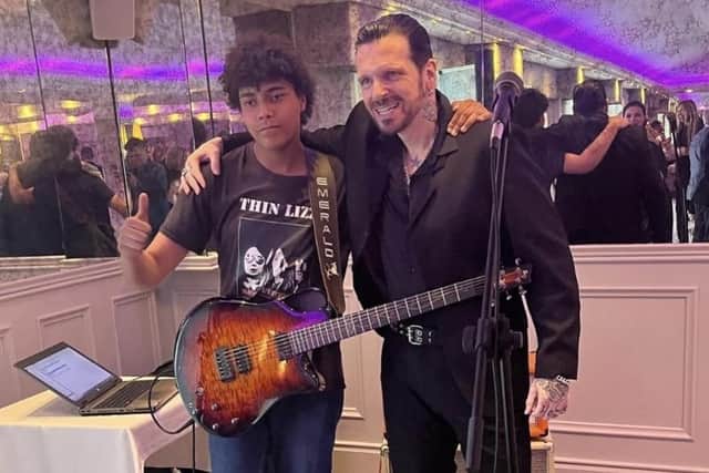 Lurgan teenager Zac Mac (15) with Thin Lizzy front man Ricky Warick who has asked Zac to support the band on stage.