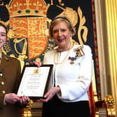 Sarah is pictured in formal setting of The Throne Room at Hillsborough Castle, receiving her accolade from Mrs Alison Millar, His Majesty’s Lord Lieutenant for the County of Londonderry.