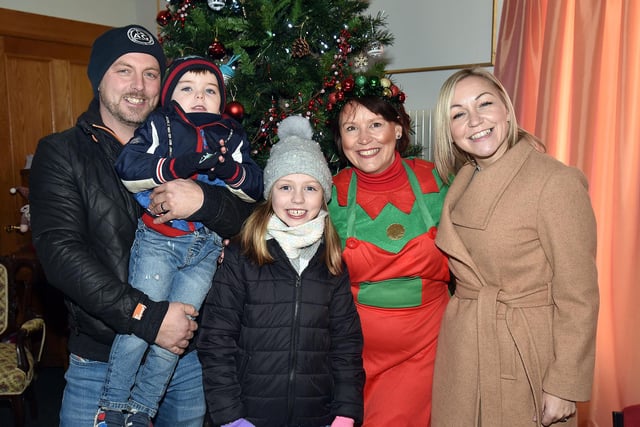 Tracey Agg of Knitted Knockers pictured with the Lawrence family at the Christmas market.  Included from left are, dad, Graham, Jake (4), Erin (9) and mum, Victoria. PT51-205.