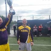 Angela Mc Cabe Cup Winners of 2023):	Meigh Rovers took the prize. Pictured here is Meigh Rovers Captain Paddy McCann lifting the cup with Frank McCabe who organised the event.