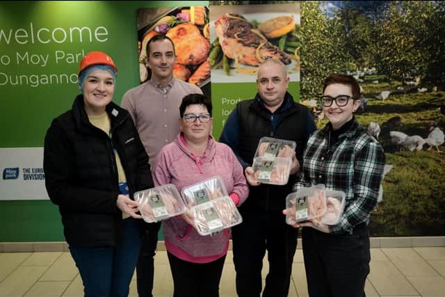 Robert Robinson and Justine Genyte from Moy Park pictured alongside representatives from Coalisland Foodbank and Skegoneil Community Foodbank.