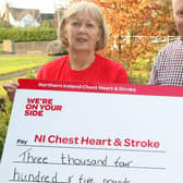 Baylon McCaughey pictured with Valerie Saunders, Area Representative for Northern Ireland Chest Heart and Stroke, who received a cheque for £3,405 from Baylon, the proceeds of badge sales for the charity. Photo: Norman Bell.