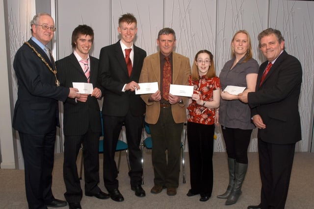 Craigavon Mayor Councillor Kenneth Twyble, Robbie Clarke, CSAC chairman and Adrian Logan, Compere, present the sports bursaries to Michael Murray Thomas Martin, Kathryn Anderson and Alison Bell back in 2007.