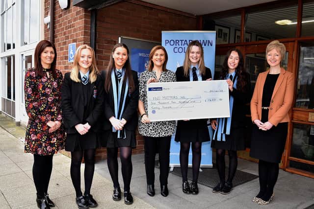 Portadown College representatives hand over a cheque for £1,420 to FND Matters NI. Included is College principal Gillian Gibb (right).
