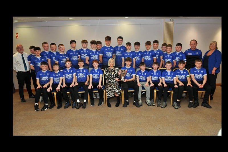 Deputy Lord Mayor, Councillor Sorcha McGeown and Councillors, Mary O'Dowd, Liam Mackle and coach Stevie Lavery with the Clan Na Gael, Boys Under 14.5 team who won the Division One League.