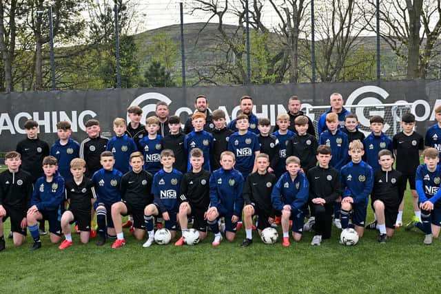 Young players and coaches from Shankill Juniors FC and St Oliver Plunkett FC U13s pictured ahead of their joint trip to the prestigious Holland Cup in April 2025 as part a cross-community initiative uniting two of Belfast’s leading grassroots clubs through football, friendship and shared ambition.