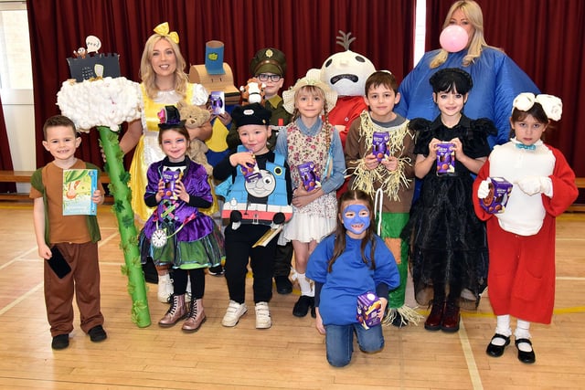 Millington Primary School teachers, Mrs Lauren Dowey, left, and Mrs Jenna Whiteman pictured with pupils who dressed up for World Book Day. PT10-2-6.