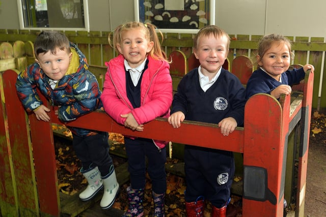 The outdoor play bus is popular with the kids at Portadown Integrated Primary School Nursery Unit including from left, Theo, Sophia, Myles and Ellianna. PT42-210.