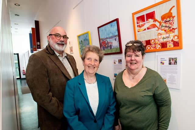 Dementia NI Members, from left,  Davie McElhinney, Yvonne Thompson and Allison Batchelor share artworks challenging misconceptions about dementia. Credit: Submitted