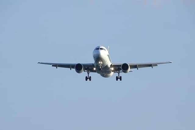 Airplane flying in the sky. Free public domain CC0 photo.