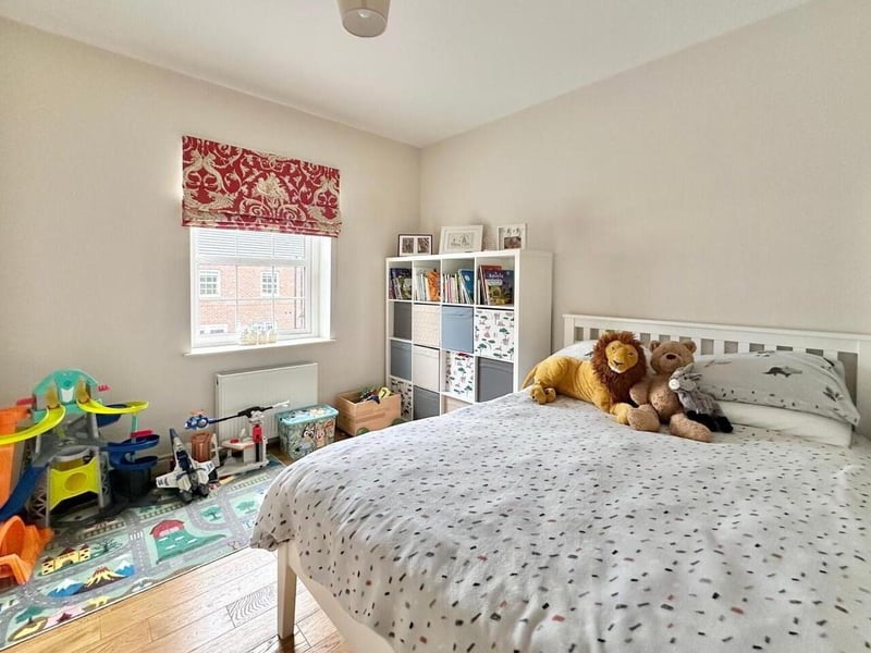 Bedroom with solid wood floor.