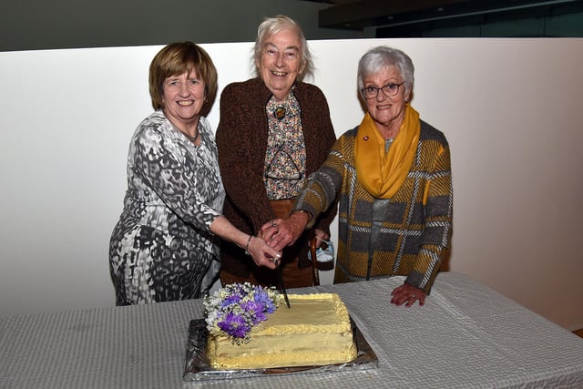 Cutting the cake at the Portadown Festival Association 100th anniversary event are from left, Kate Adams, chairperson; Miss Rosalind Hadden, Association president, and Carolyn McCabe, former chairperson. PT45-206.