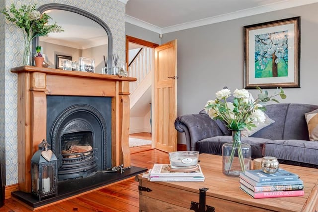 Family room with feature cast iron horseshoe style fireplace.