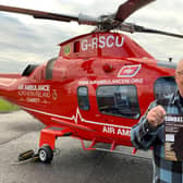 Rodney Houston visiting the Air Ambulance Northern Ireland base in Lisburn to promote his new book, 'Combatant'.
